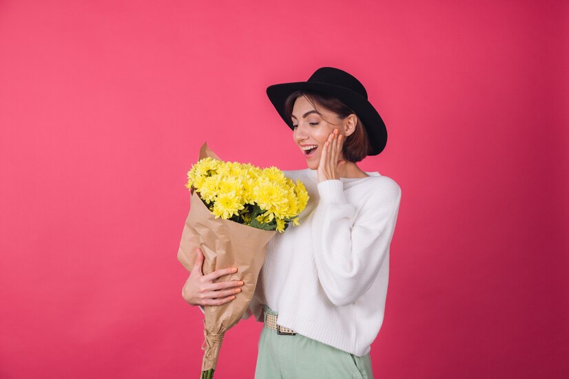 stylish-woman-hat-casual-white-sweater-red-wall_343596-5440.jpg